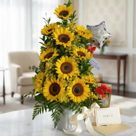 Arreglo floral "Arreglo con Girasoles Halo" sobre una mesa de mármol, con girasoles vibrantes, follaje verde, un globo de "Fe